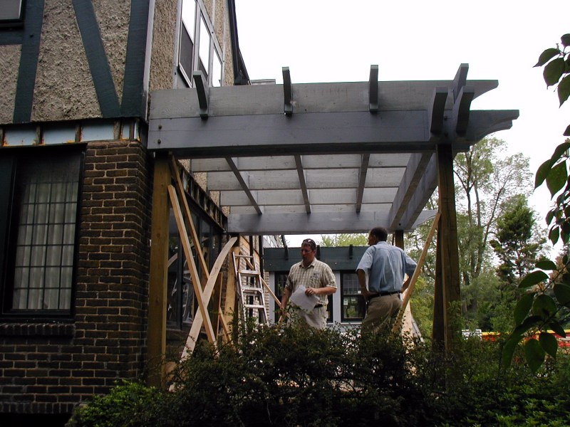 Chris inspects pergola adjustments
