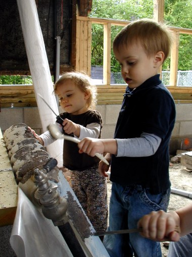 Isabel and Courtland get the old radiator ready for a new coat of paint while Mom gives a hand