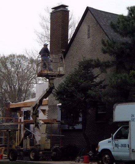 Rodney on his way down after installation of Pewabic tile near peak
