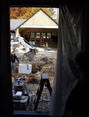 Vince lowers the sump casting into center of driveway