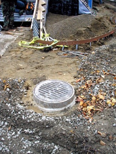 Drain to sump pit awaiting concrete driveway