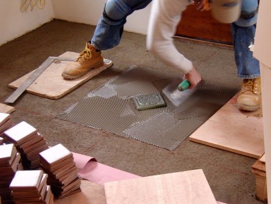 First decorative tile installed. Note chalk marks.