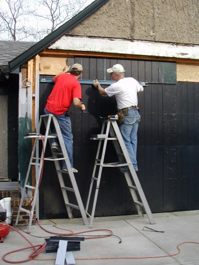 Dan and Keith install the top tongue and groove panel