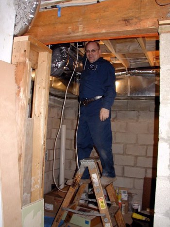 Charles fishes wire to AC outside compressor