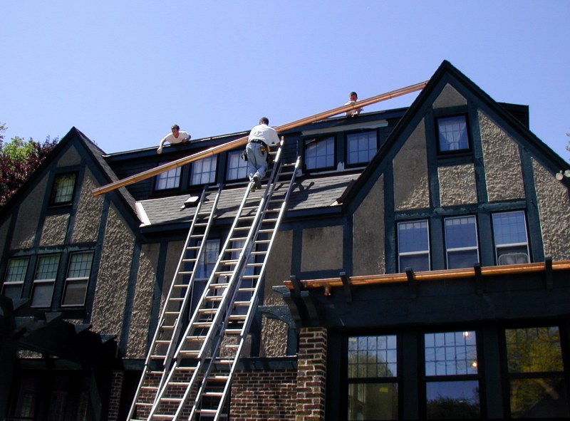 Cliff Maschke delivers gutter to rooftop