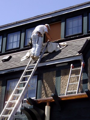 Pat Trombley replacing and painting dormer siding