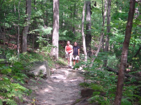 Beth climbing the Dragon's Tooth trail with Laura