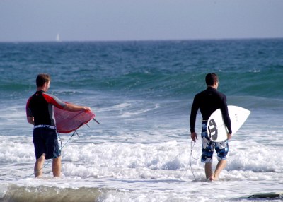 Heading out to surf the Pacific