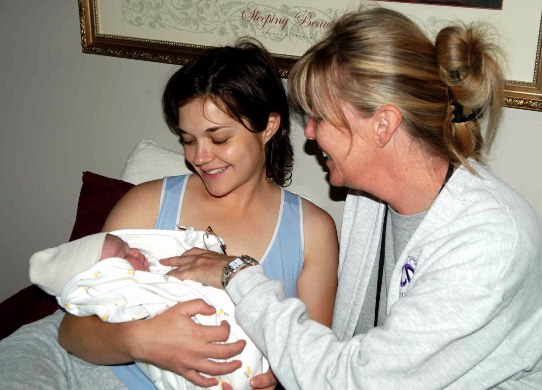 Happy Mother, baby and midwife